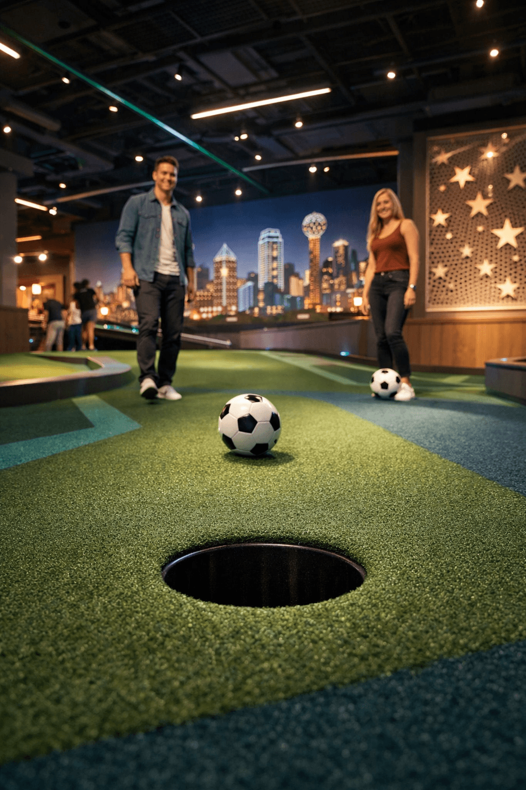 Couple playing at indoor Dallas-themed course
